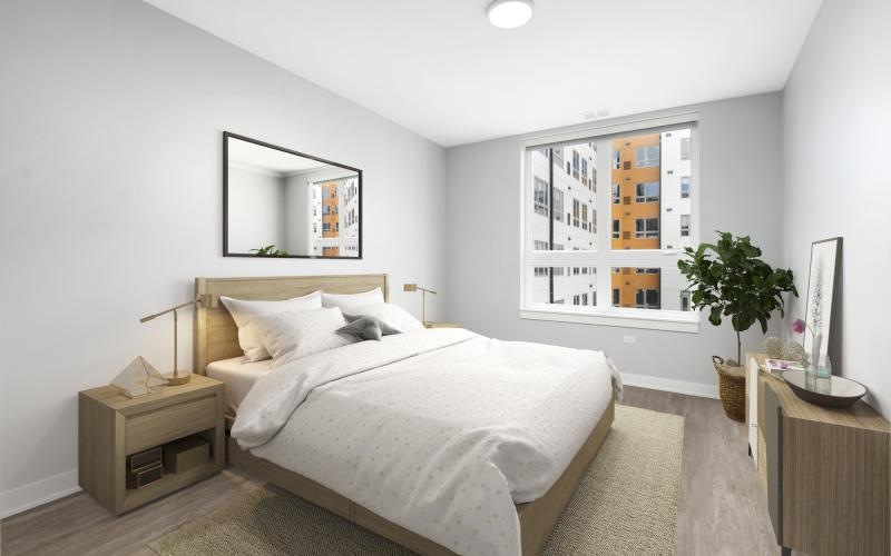 a bedroom with a large window